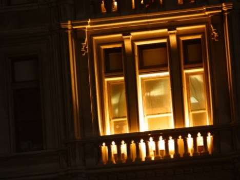 lights-glowing-through-tall-windows-and-balcony-at-night-in-new-york-city_i-G-36-3610-5X7EF00Z